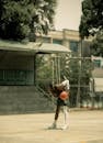 Street Basketball Player with Red Ball