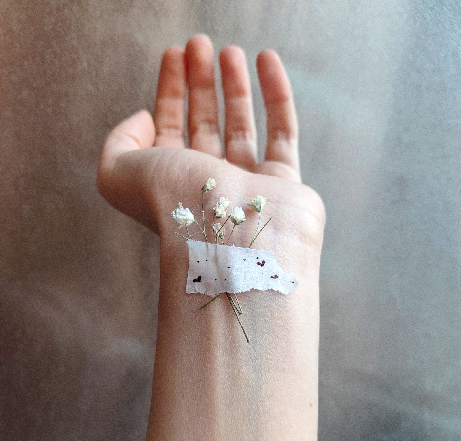 Person resting forearm and hand after repetitive gripping activity