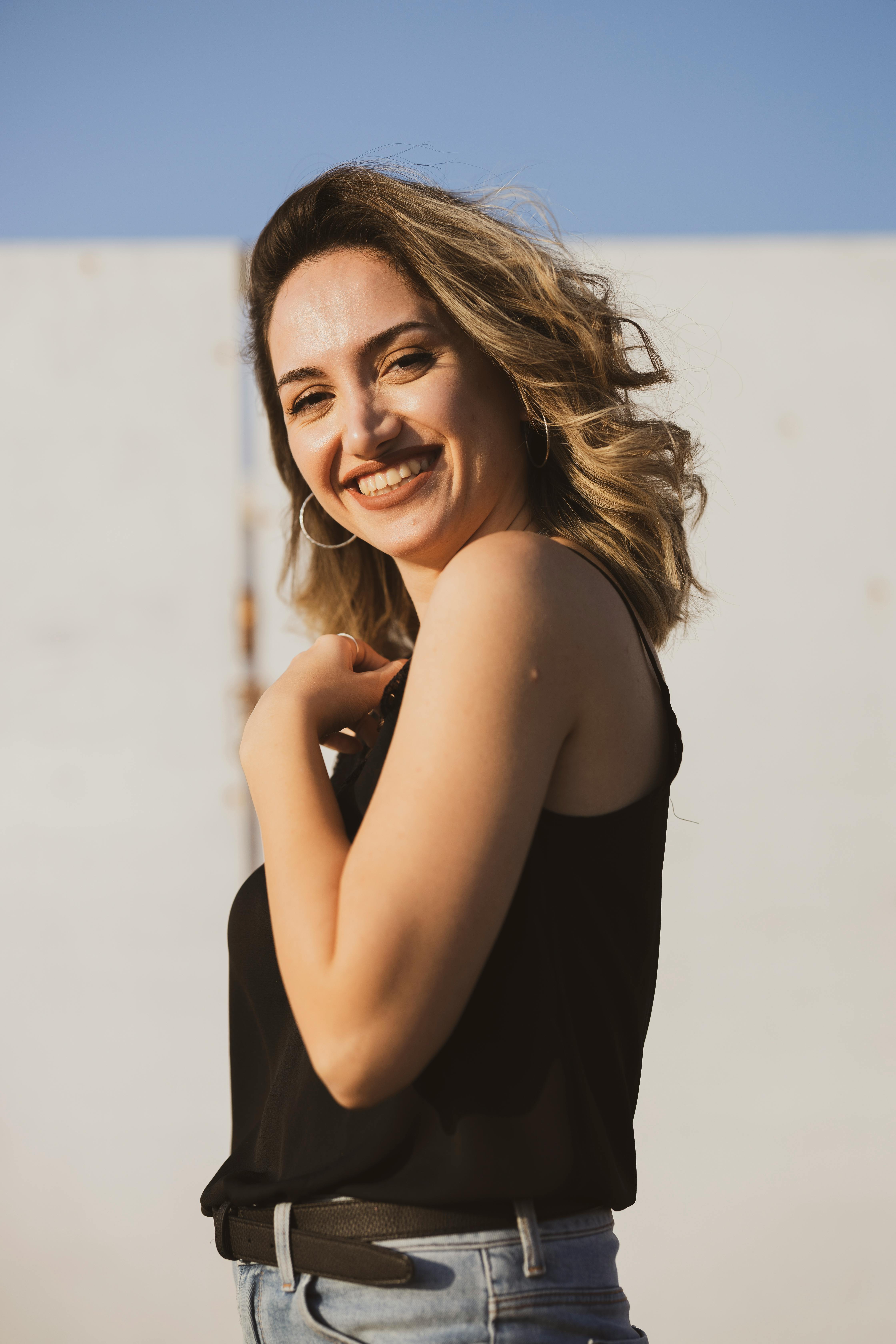 photo of woman wearing black tank top