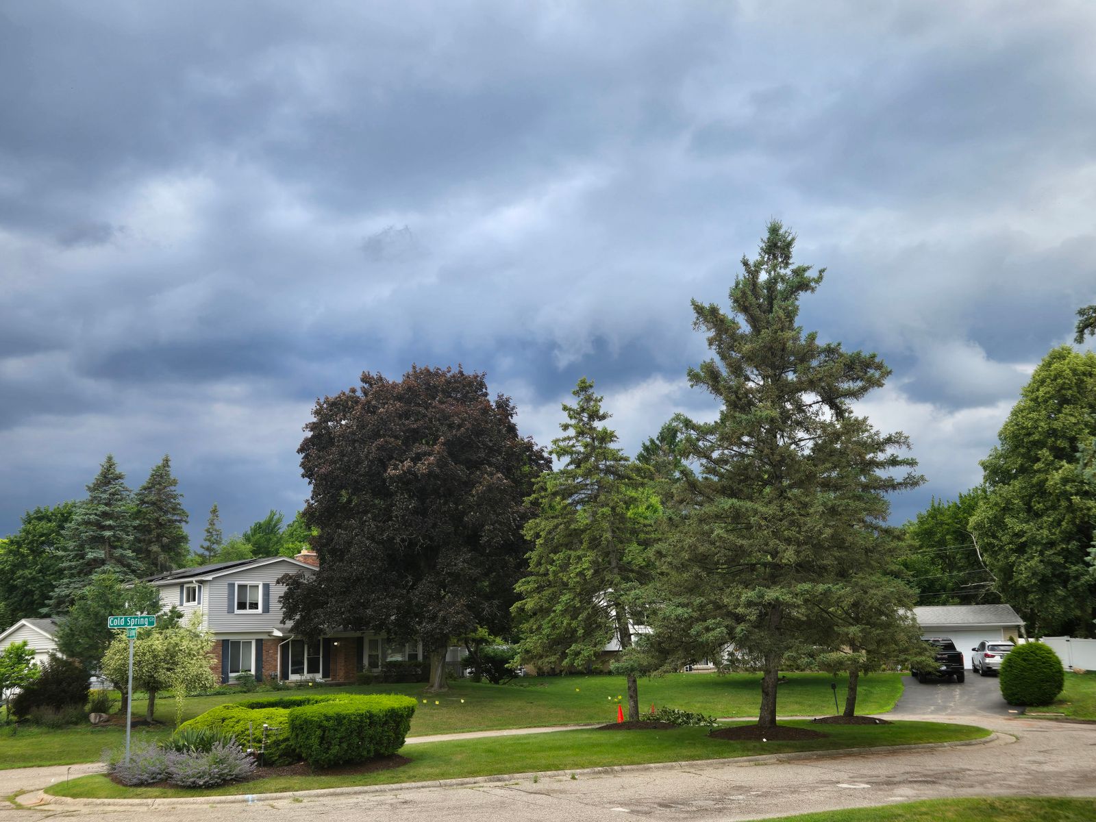 Suburban house under dark storm clouds