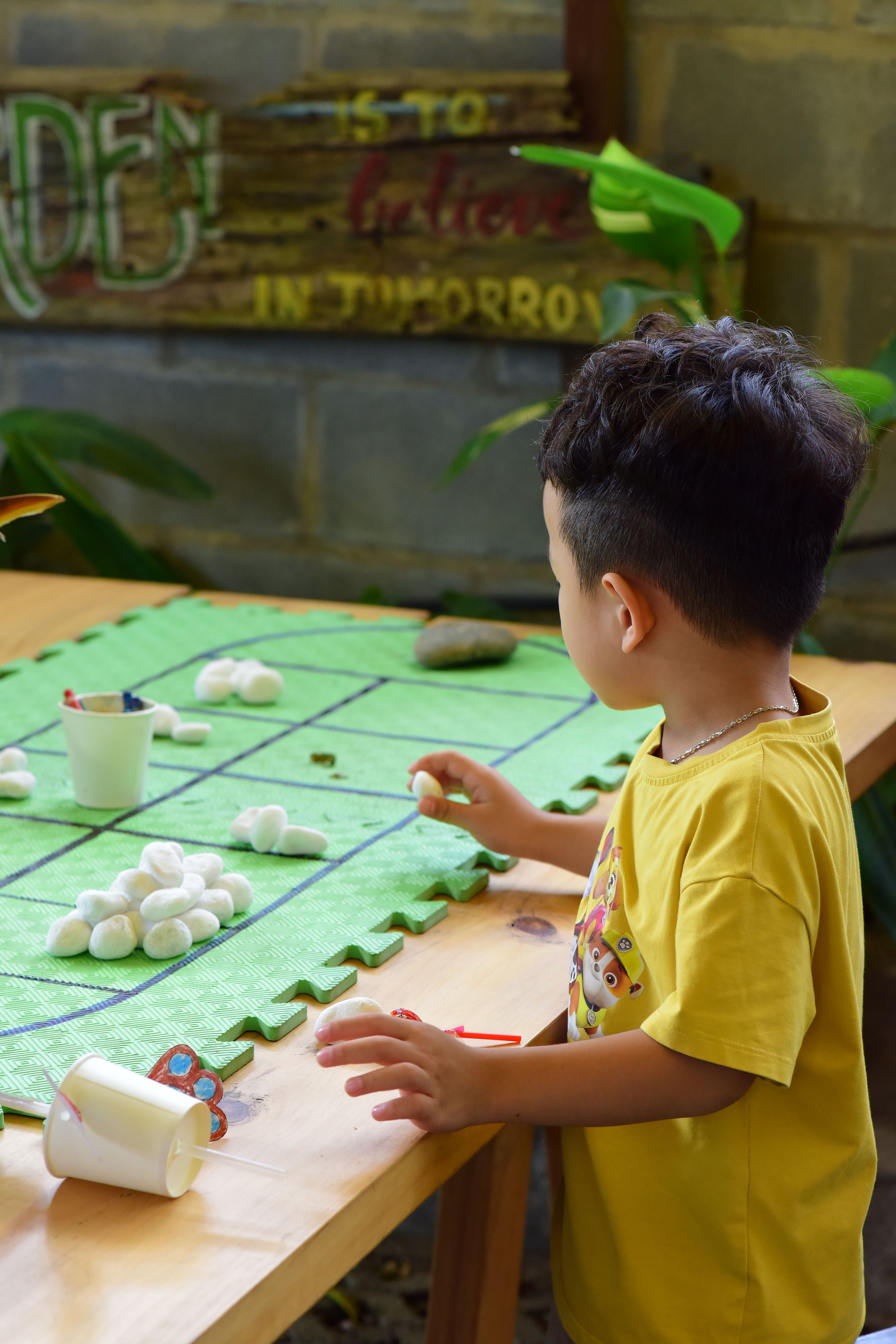 Child Engaged in Educational Craft Activity Indoors · Free Stock Photo