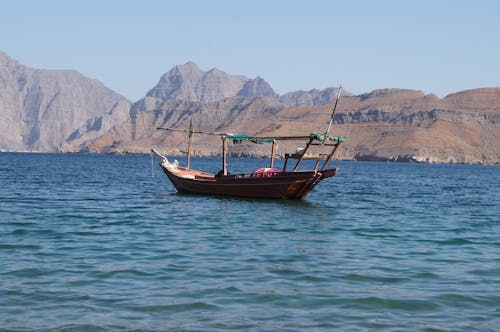 Free stock photo of boat, mountains, sea Stock Photo