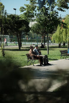 Two senior men sharing a peaceful afternoon in an Istanbul park.
