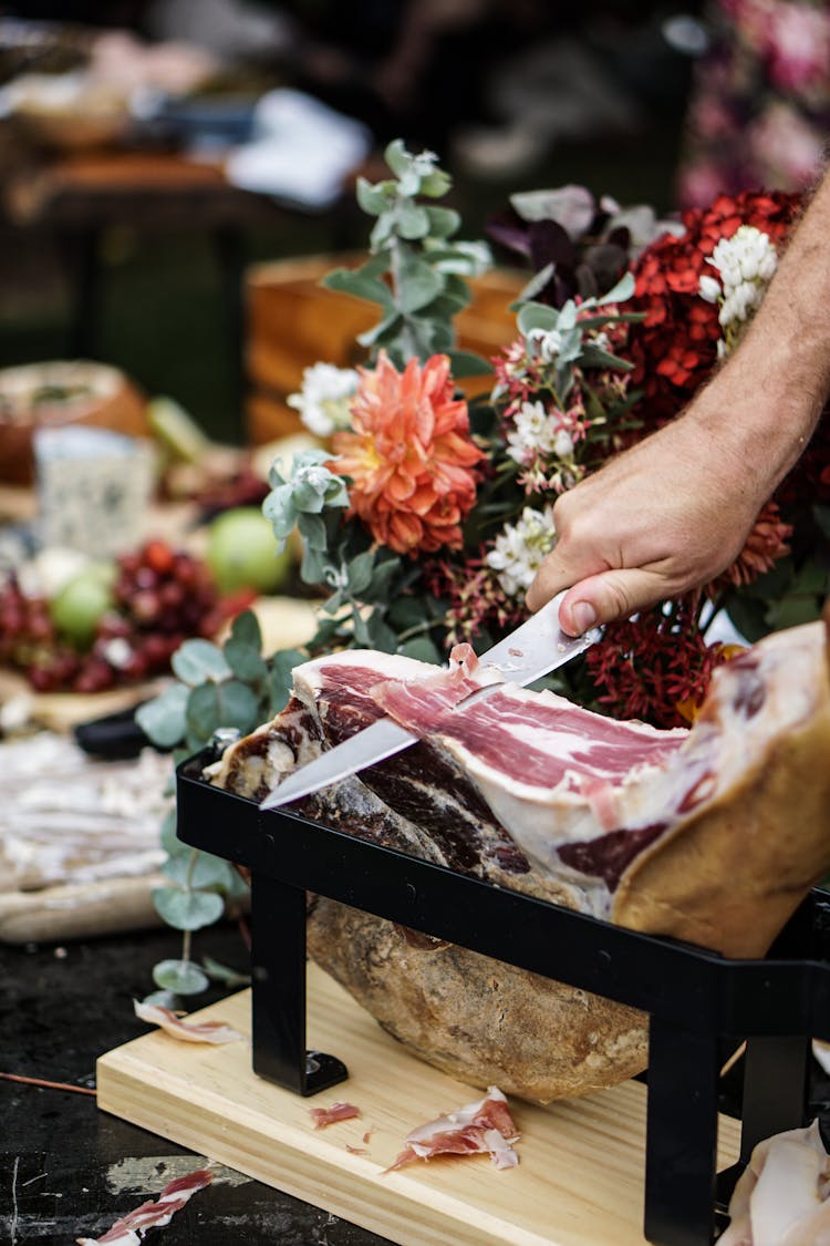 Person Slicing Meat