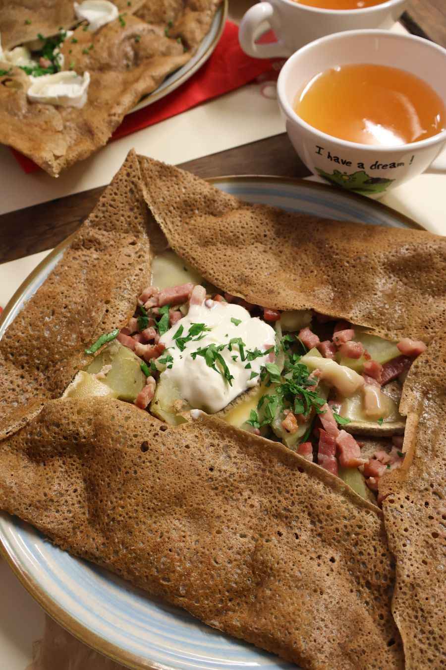 A dark buckwheat galette with folded corners