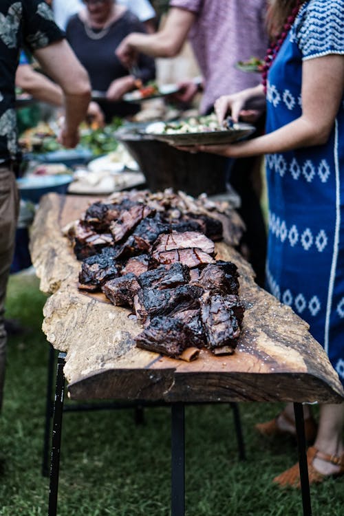 Grilled Meat Laid on a Wood Slab