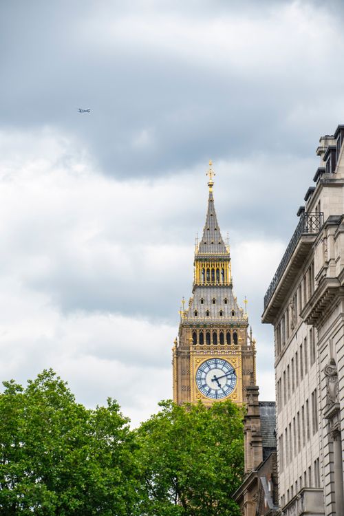 Free Classic view of Big Ben's clock tower against a cloudy sky in London. Architectural and historic landmark. Stock Photo