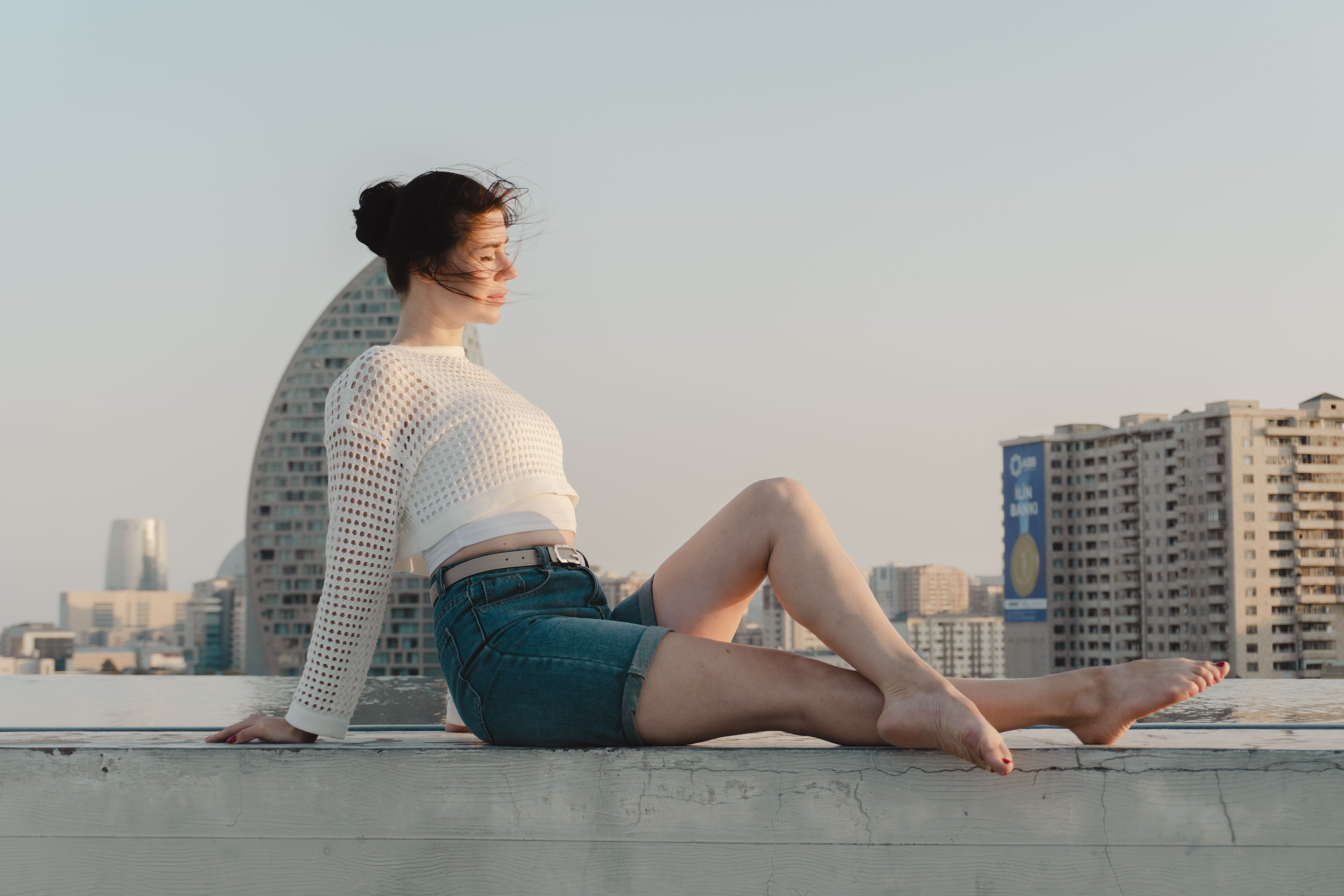 Urban Rooftop Portrait at Sunset · Free Stock Photo