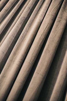 Abstract image of wrinkled gray fabric creating dynamic textures and shadows, ideal for interior decor themes.