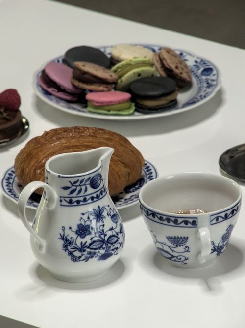 Free Delightful afternoon tea setup with macarons and croissant in Berlin. Perfect for relaxation. Stock Photo