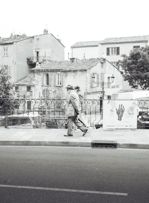Vintage-style street scene in Corsica showcasing classic architecture and serene ambiance.