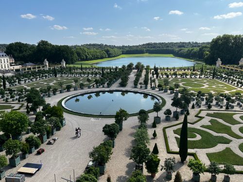 Free Stunning aerial view of symmetrical gardens at Versailles in summer. Stock Photo