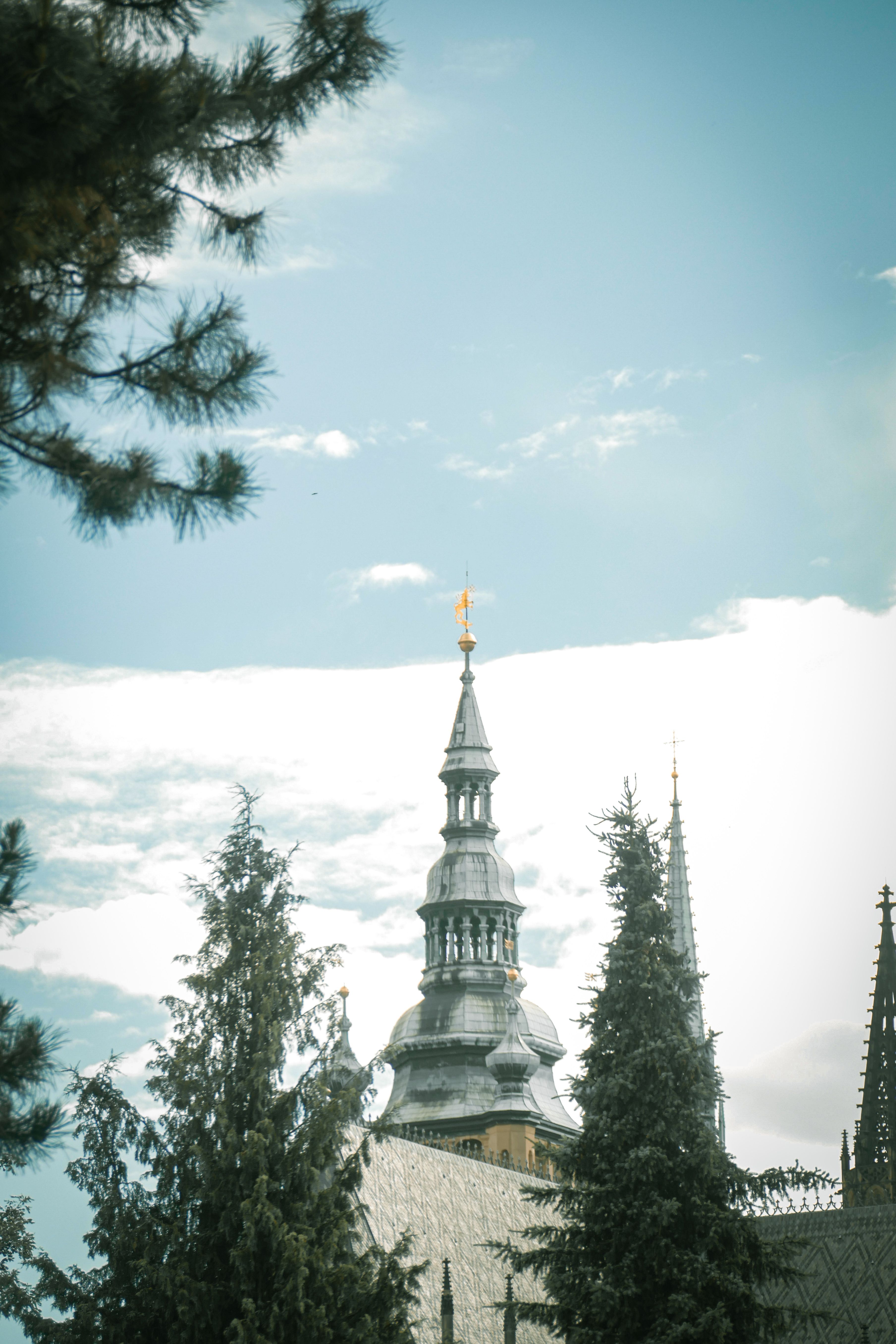Historic Church Spire Against Blue Sky · Free Stock Photo