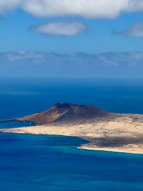 Free Stunning aerial shot of volcanic landscape and coastline in Lanzarote, Canary Islands. Stock Photo