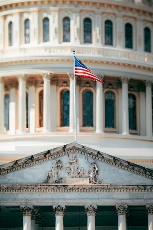 Free American flag flying in front of the United States Capitol building, Washington D.C. Stock Photo