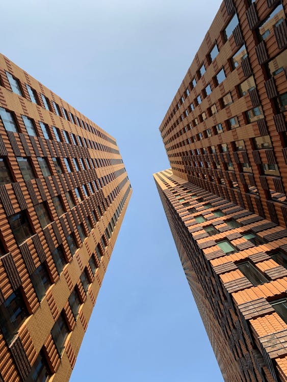 Free Low-angle Photograph of Brown Buildings Stock Photo