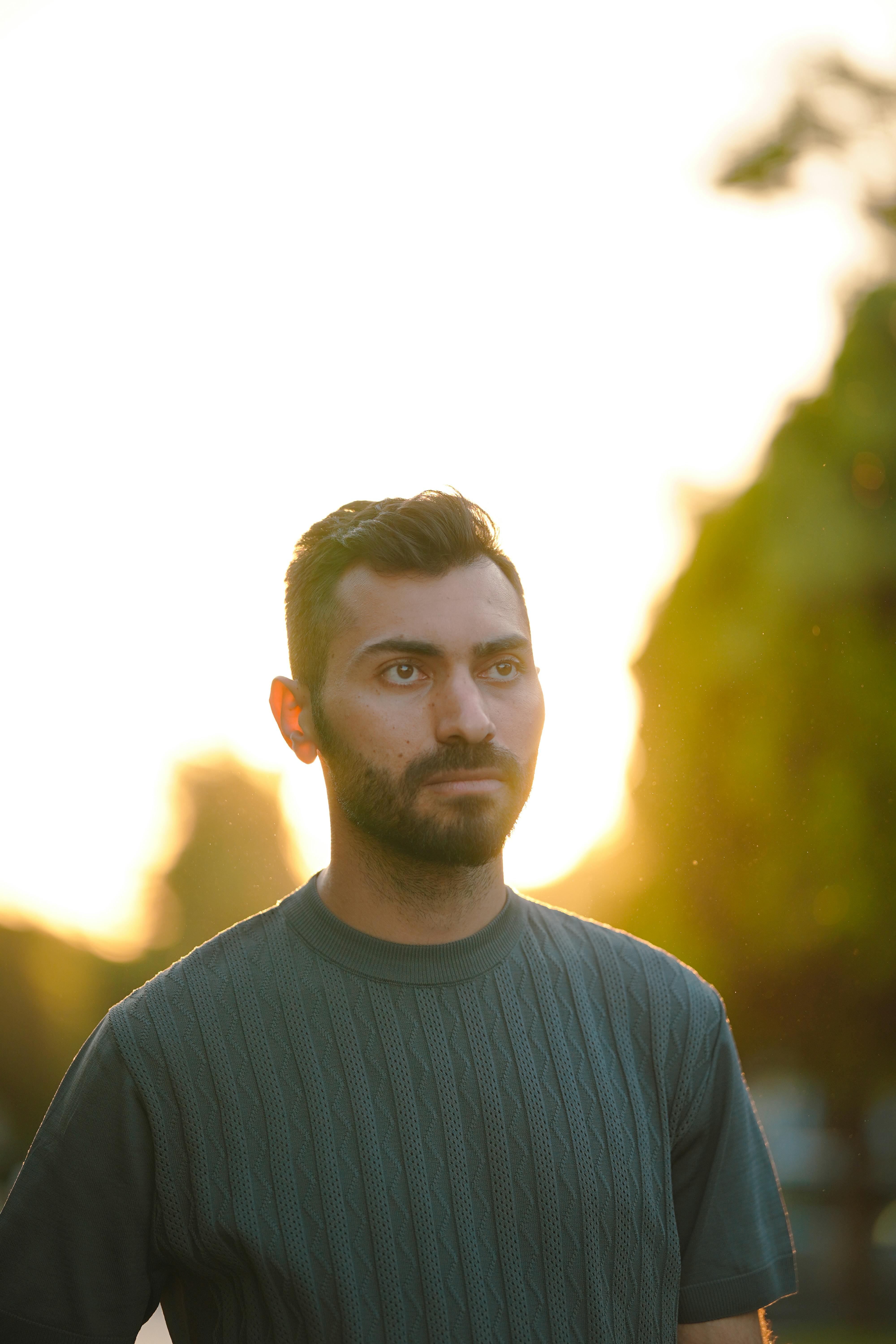 Man in golden hour light — warm atmospheric low-angle Nordic golden hour quality