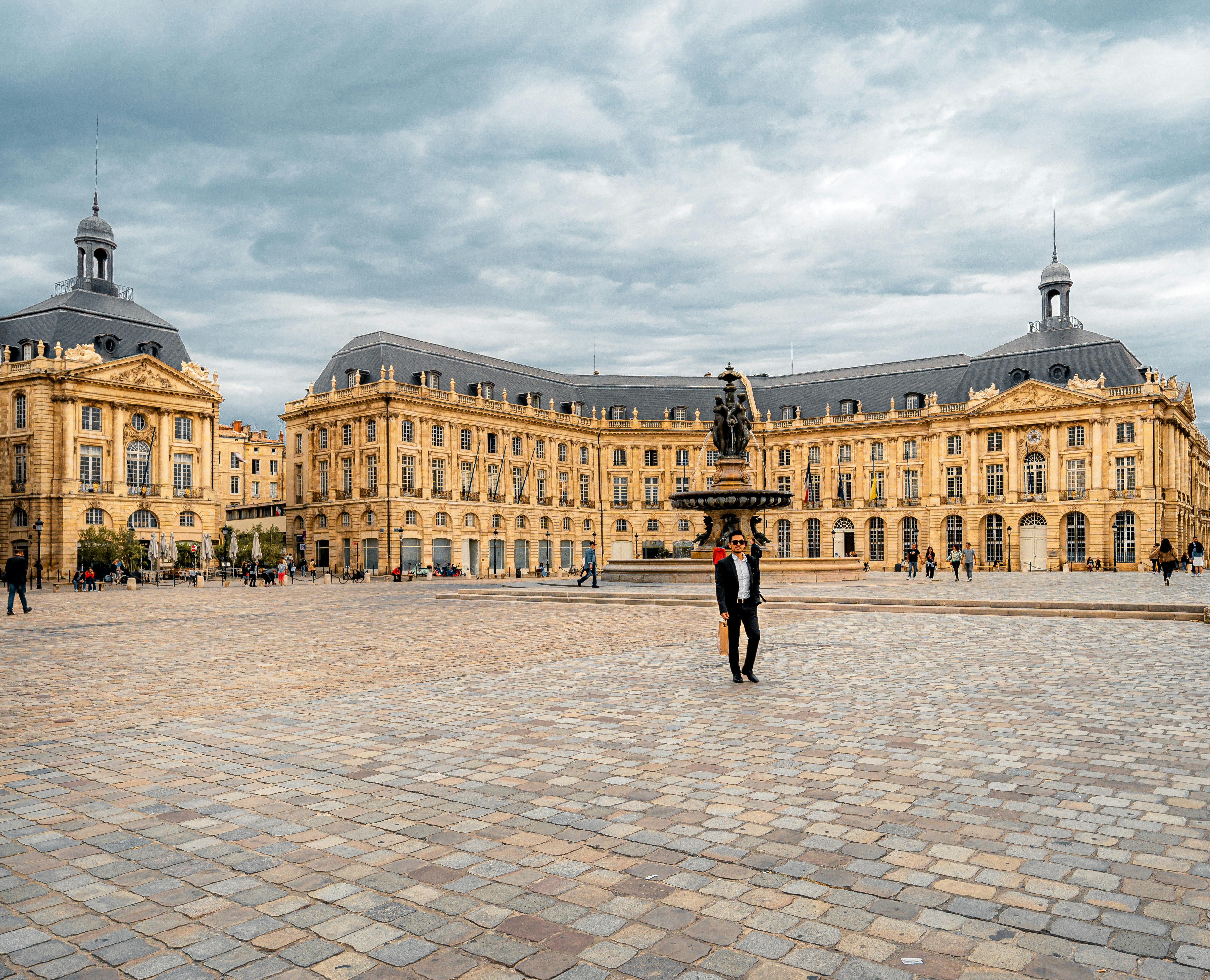Scenic view of Place de la Bourse with fountain in Bordeaux, France, showcasing its iconic architecture.