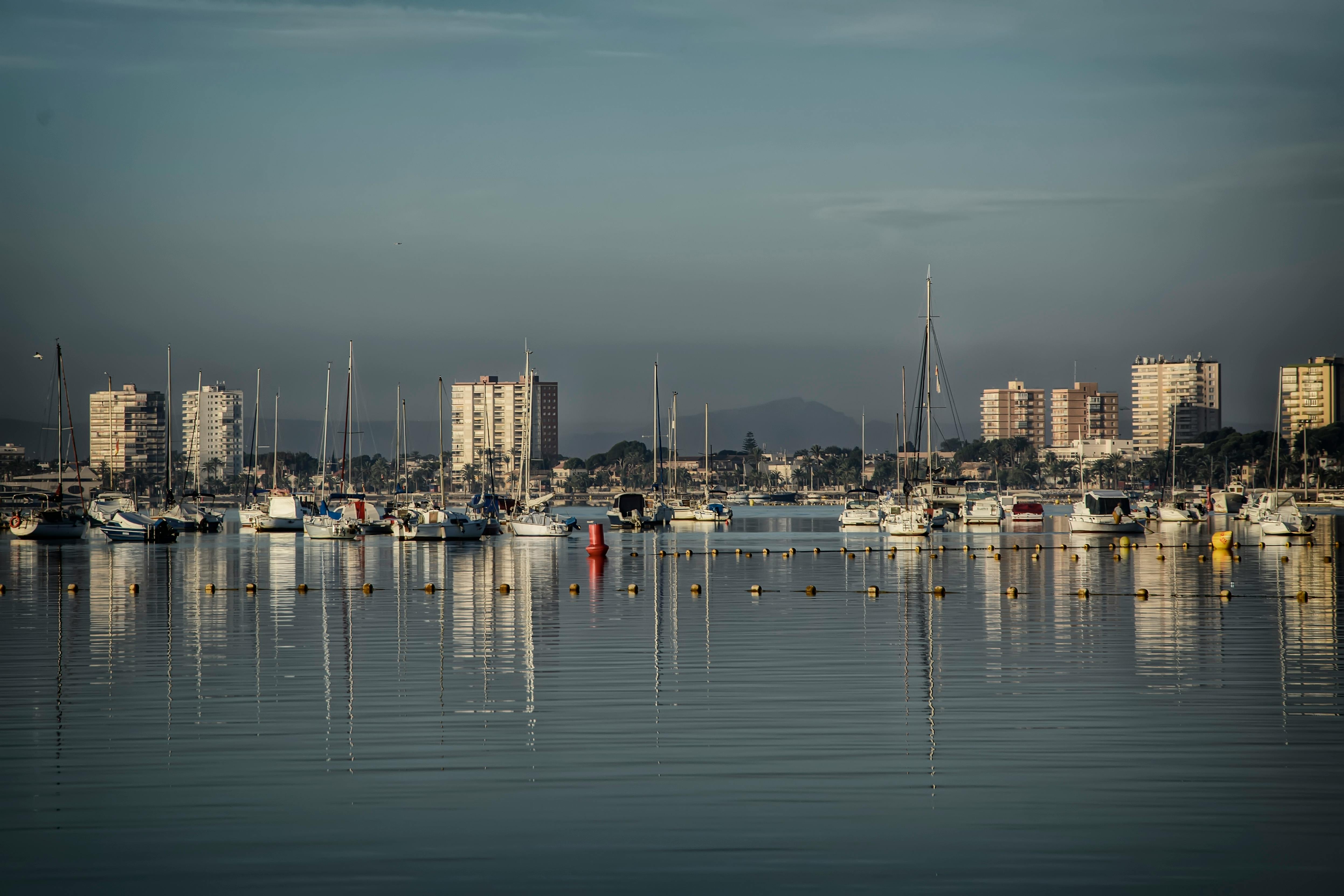 Peaceful marina scene with sailboats in San Pedro del Pinatar, Murcia, captured at dusk.