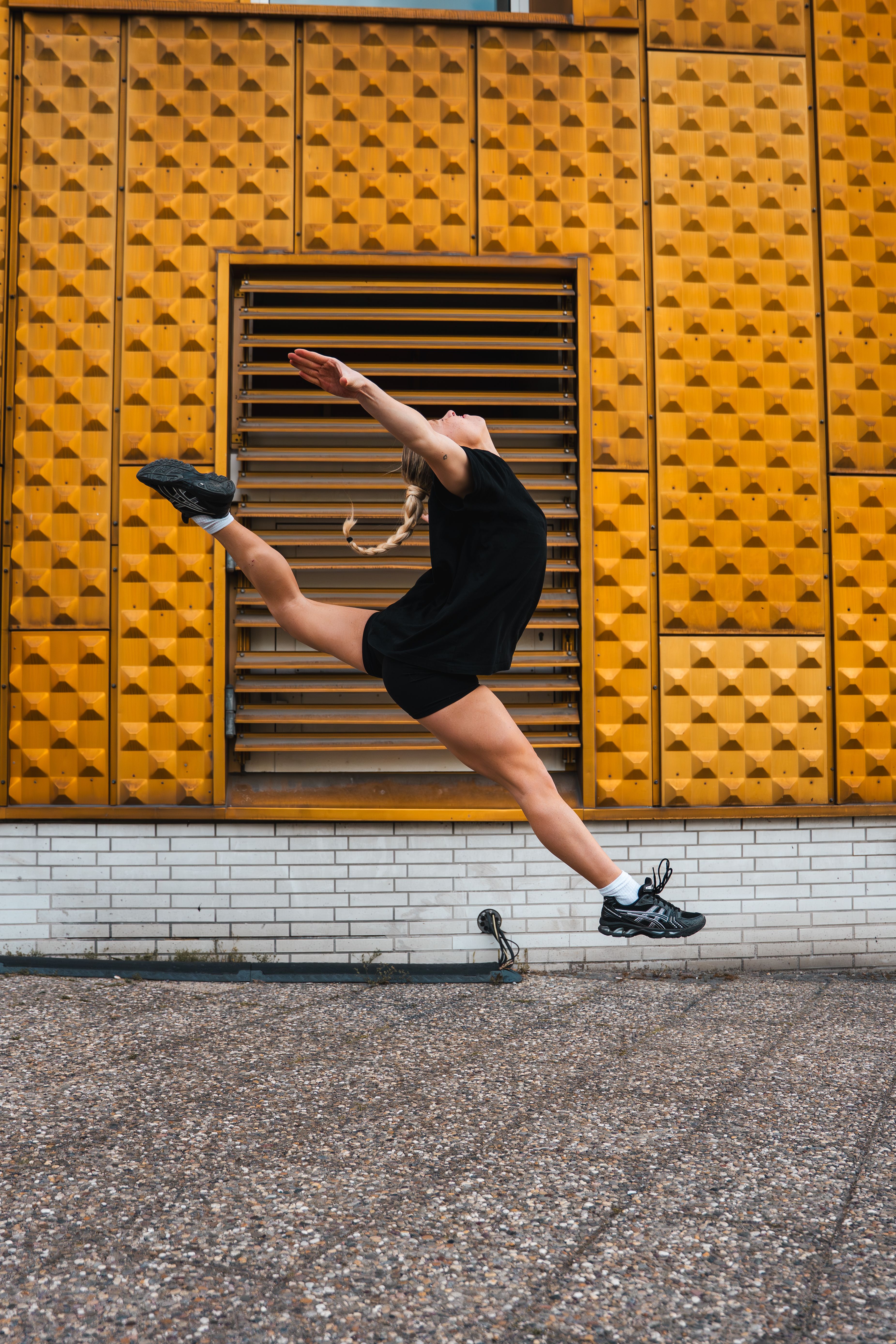 Dynamic Leap Against Modern Berlin Architecture · Free Stock Photo