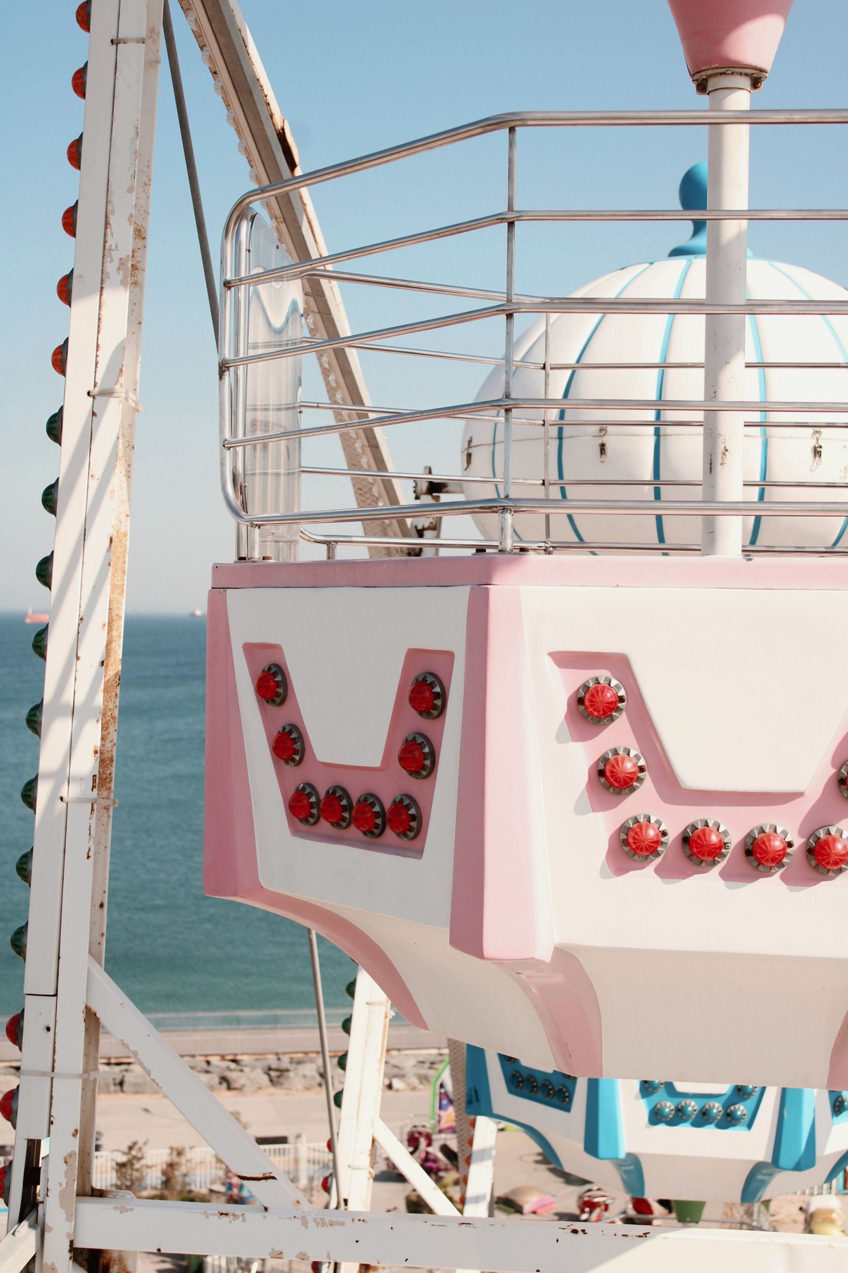 Vibrant Ferris Wheel Ride by the Ocean · Free Stock Photo