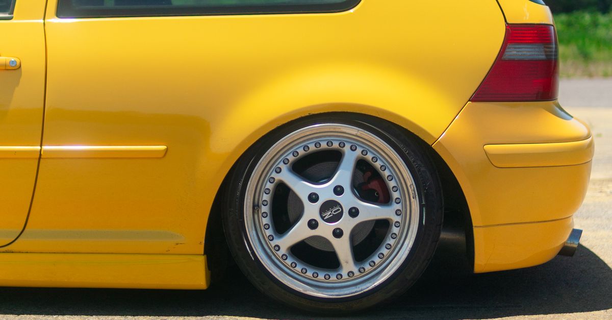 Yellow Line Rims Bright Yellow Hatchback with Custom Rims · Free Stock Photo