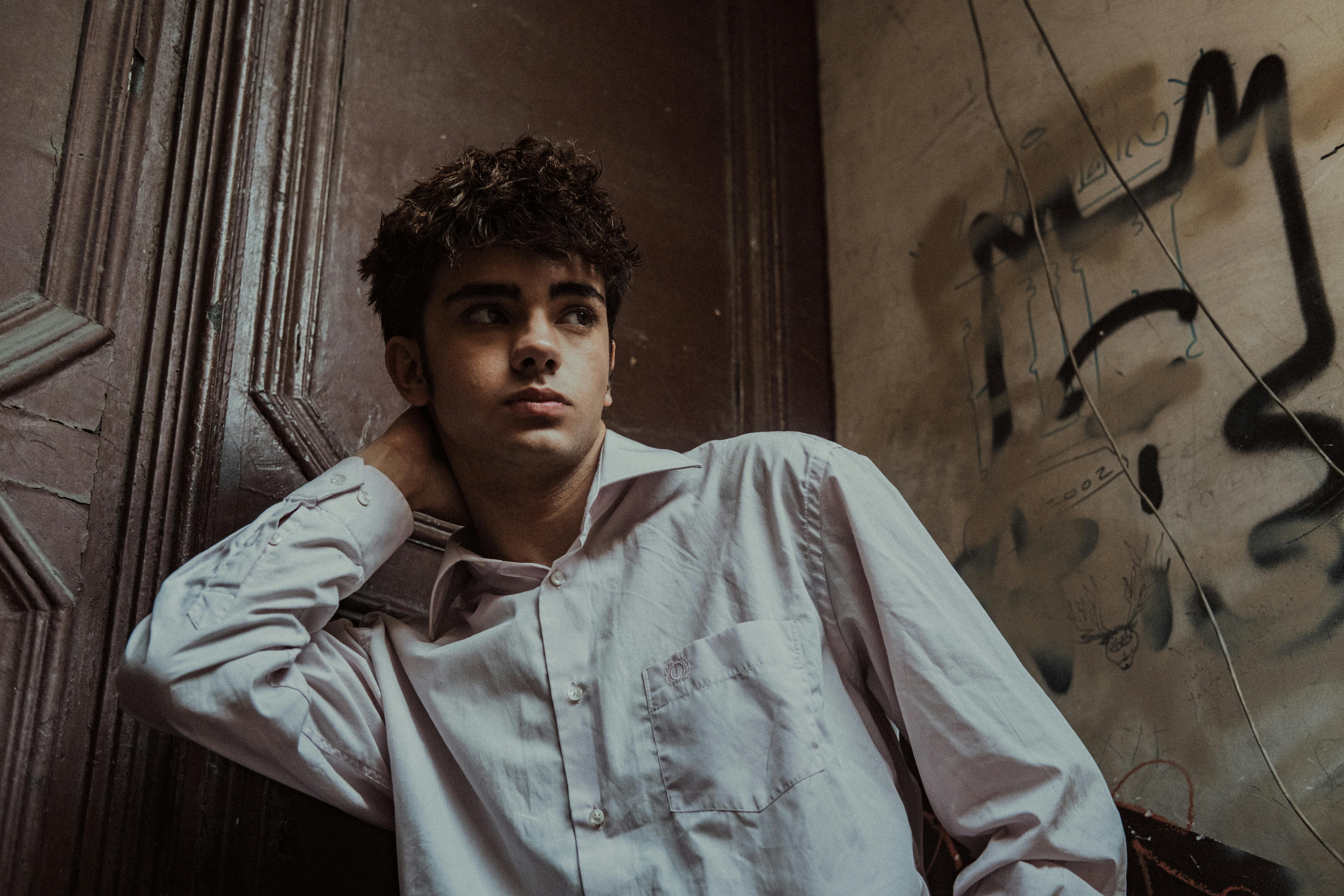 free-photo-of-contemplative-young-man-in-urban-setting.jpeg?h=1000&w=1500&fit=crop&markalign=center%2Cmiddle&txt=pexels.com&txtalign=center&txtsize=60&txtclr=eeffffff&txtfont=Avenir-Heavy&txtshad=10&mark=https:%2F%2Fassets.imgix.net%2F~text%3Ftxtclr%3Dfff%26txtsize%3D120%26txtpad%3D20%26bg%3D80000000%26txtfont%3DAvenir-Heavy%26txtalign%3Dcenter%26w%3D1300%26txt%3DFree%2520Stock%2520Photos