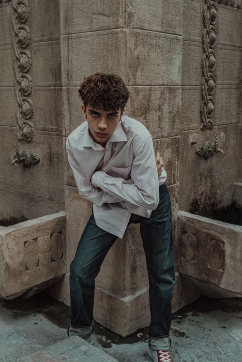 Free Fashionable young man poses in the historical streets of Istanbul, showcasing modern style. Stock Photo