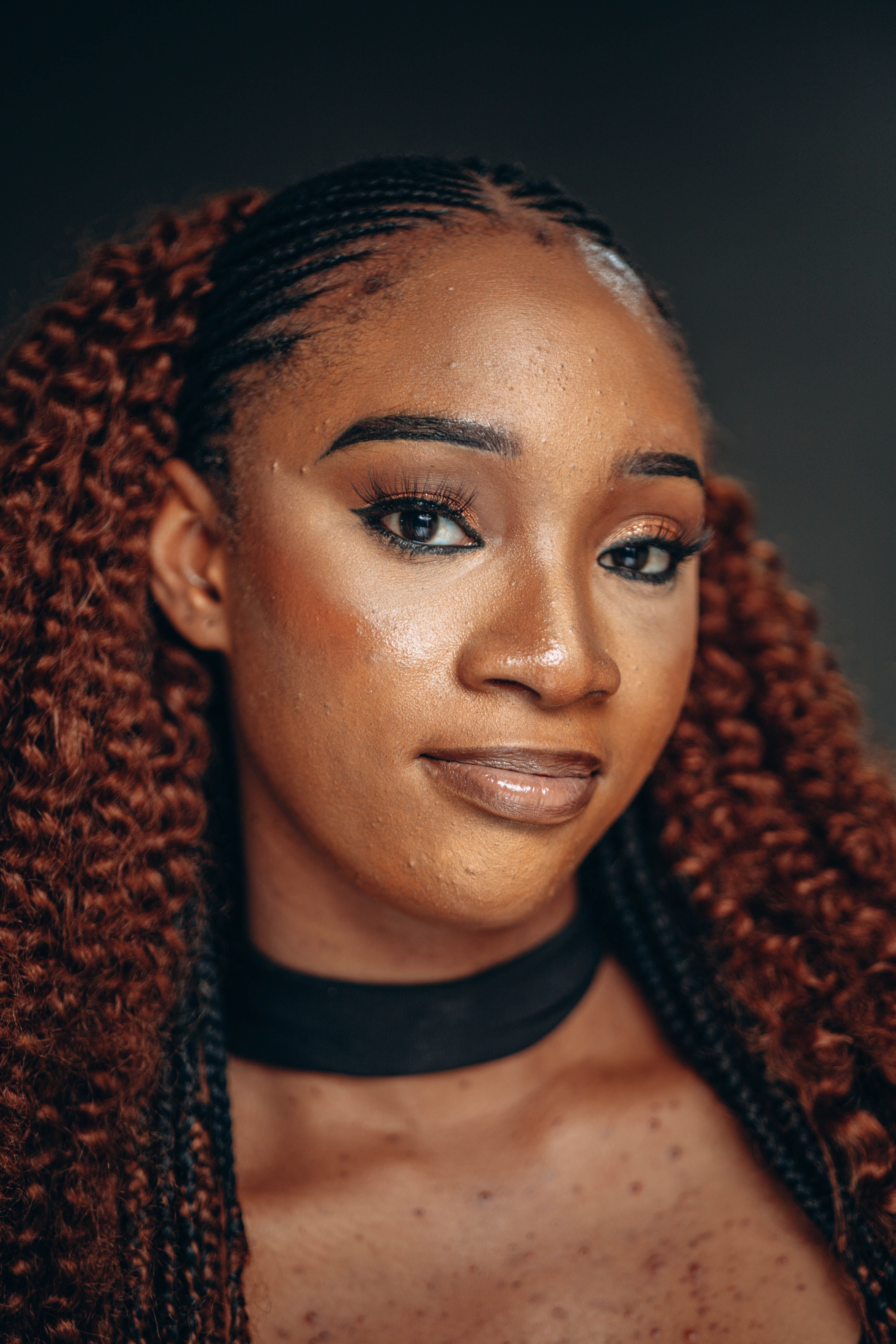Elegant Portrait of a Woman with Braided Hair · Free Stock Photo
