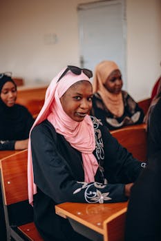 A group of young students attentively participating in a classroom setting, showcasing diversity and education.