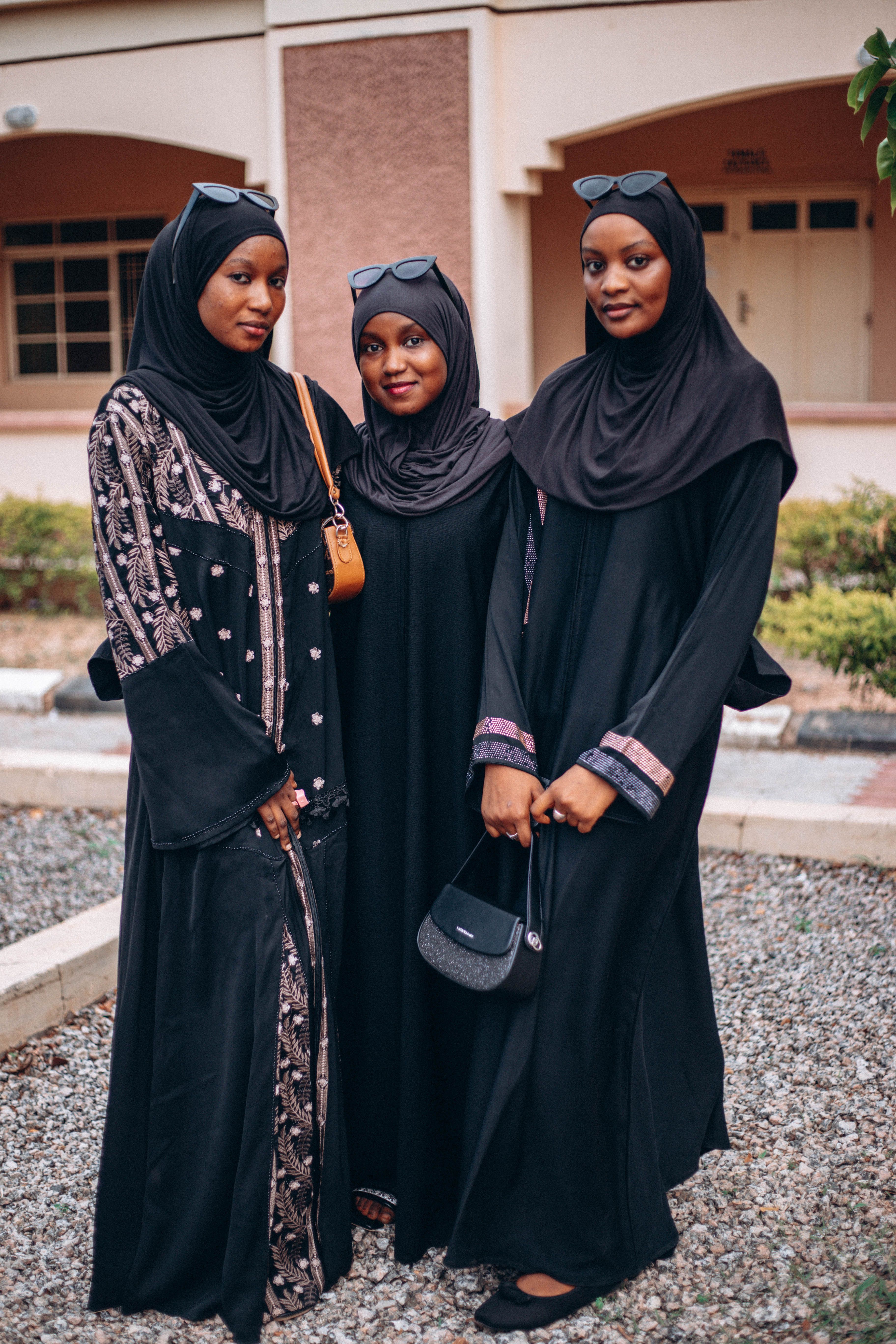 Three Women in Elegant Black Islamic Fashion Outdoors · Free Stock Photo
