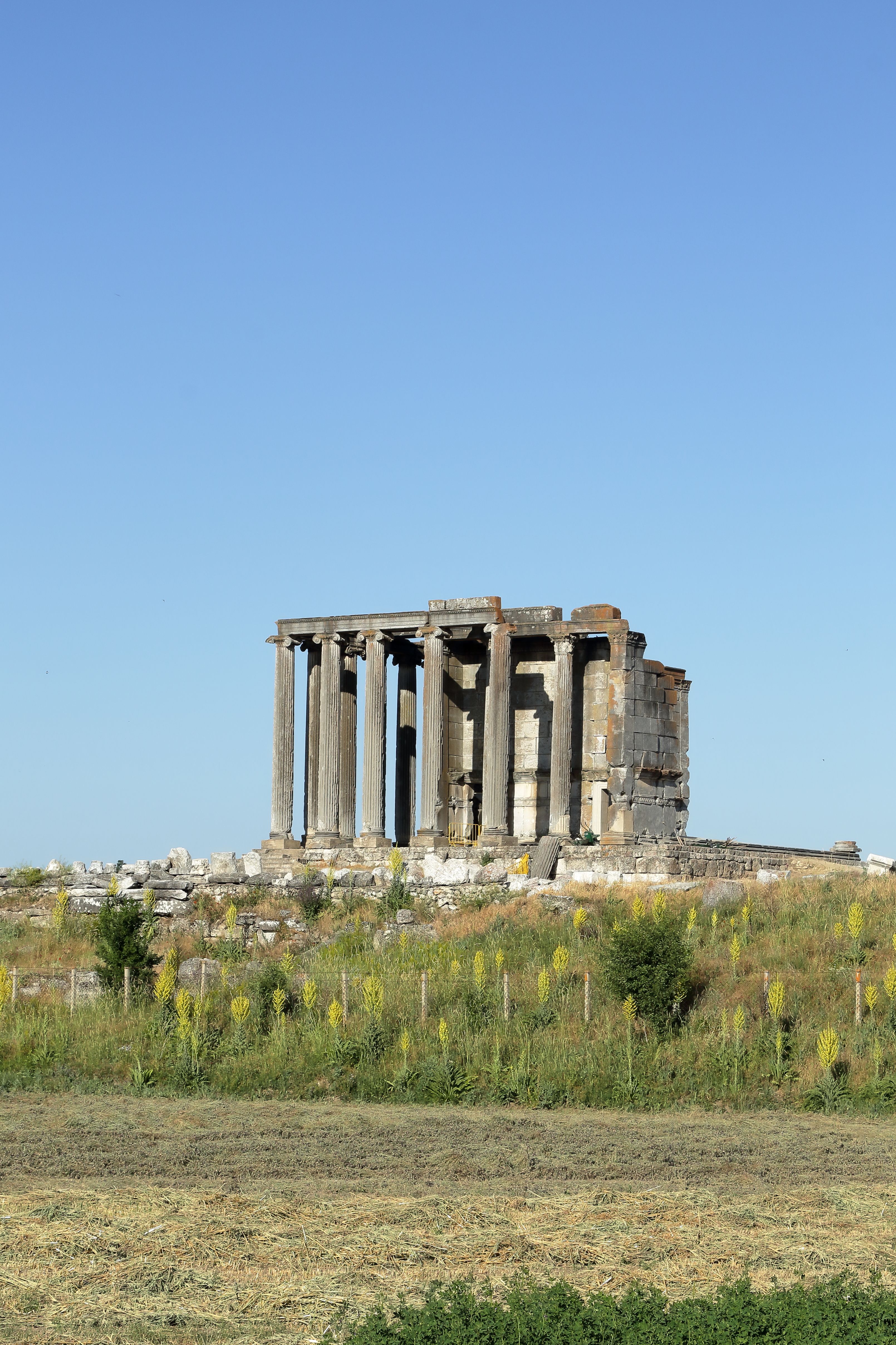 Ancient Temple Ruins in a Scenic Landscape · Free Stock Photo