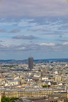 Stunning aerial shot of Paris skyline with iconic Montparnasse Tower under a vibrant sky.