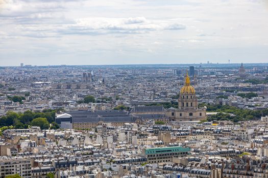 Stunning aerial view of Paris cityscape with the iconic Les Invalides and sprawling urban landscape.