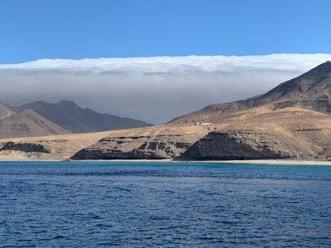 Beautiful coastal view of mountains and ocean in Fuerteventura on a sunny day.