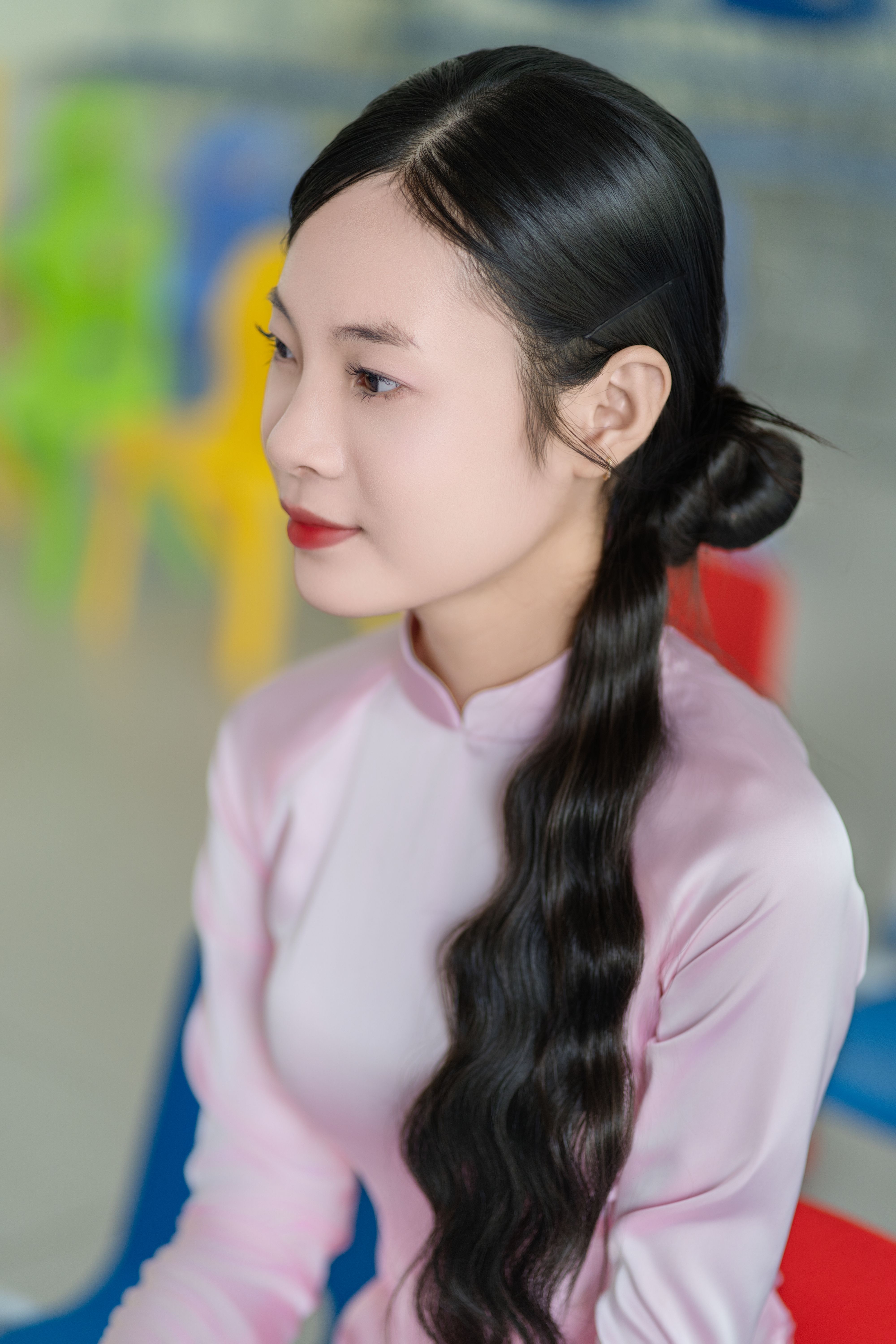 Elegant Woman in Traditional Pink Attire Indoors · Free Stock Photo