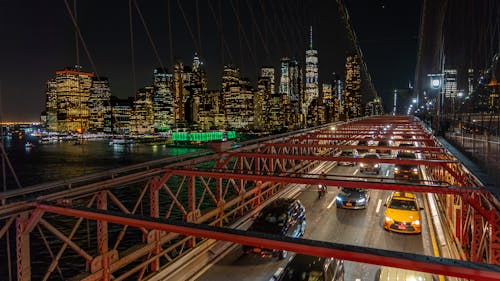 Vehicles Passing by a Bridge during Nighttime