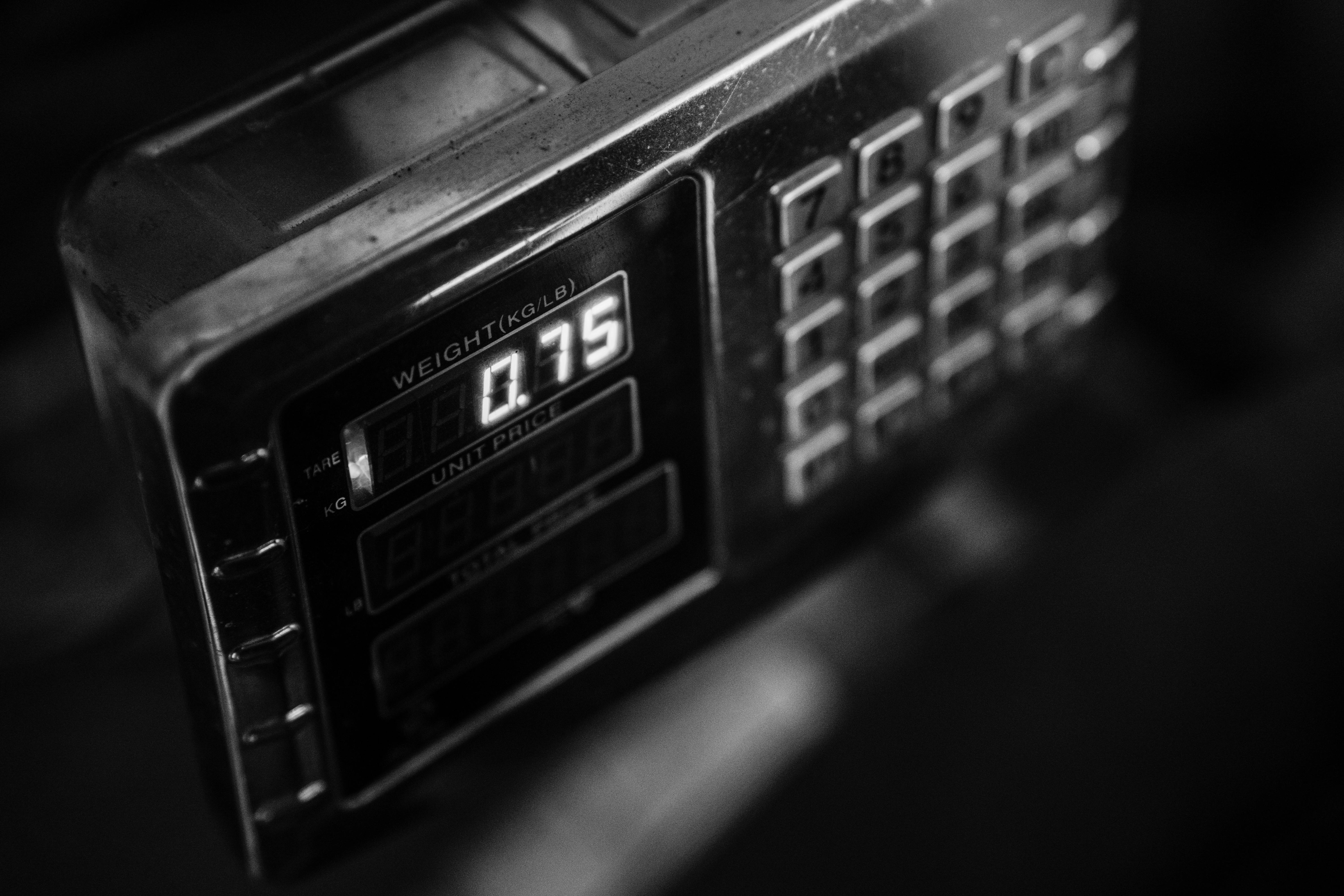 Free Close-up of a digital weight scale in black and white, showcasing measurement settings. Stock Photo