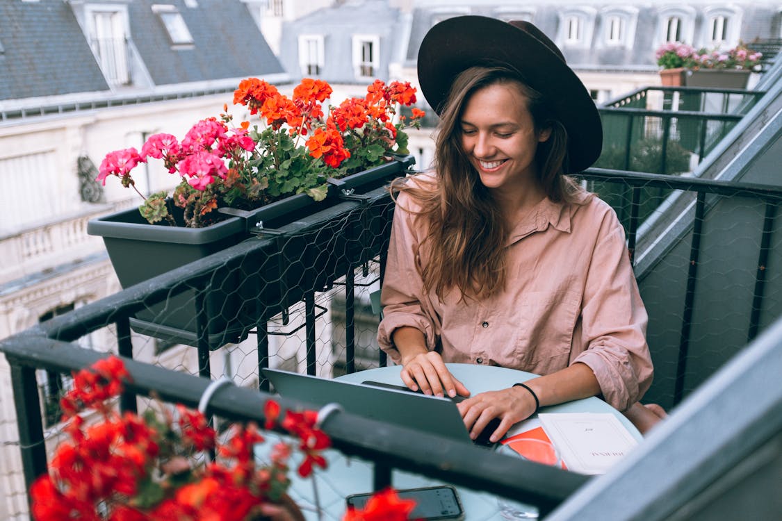 Woman Wearing Beige Dress Shirt working remotely