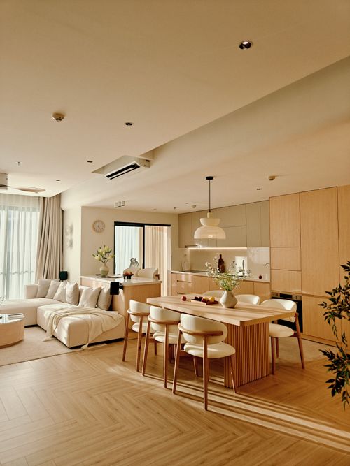 Free Bright, minimalist living room with wooden accents in Vietnam, offering serene elegance. Stock Photo
