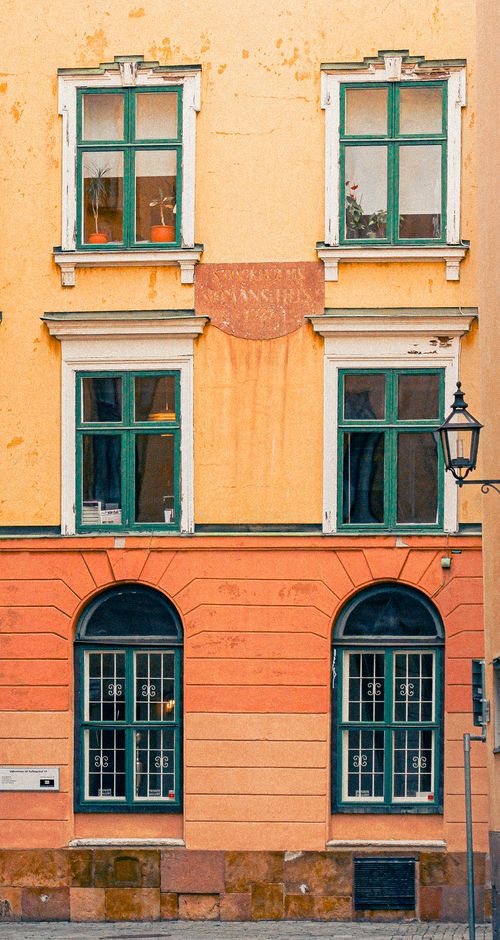 Free Colorful facade of a historic building in Stockholm's Gamla Stan, Sweden. Stock Photo
