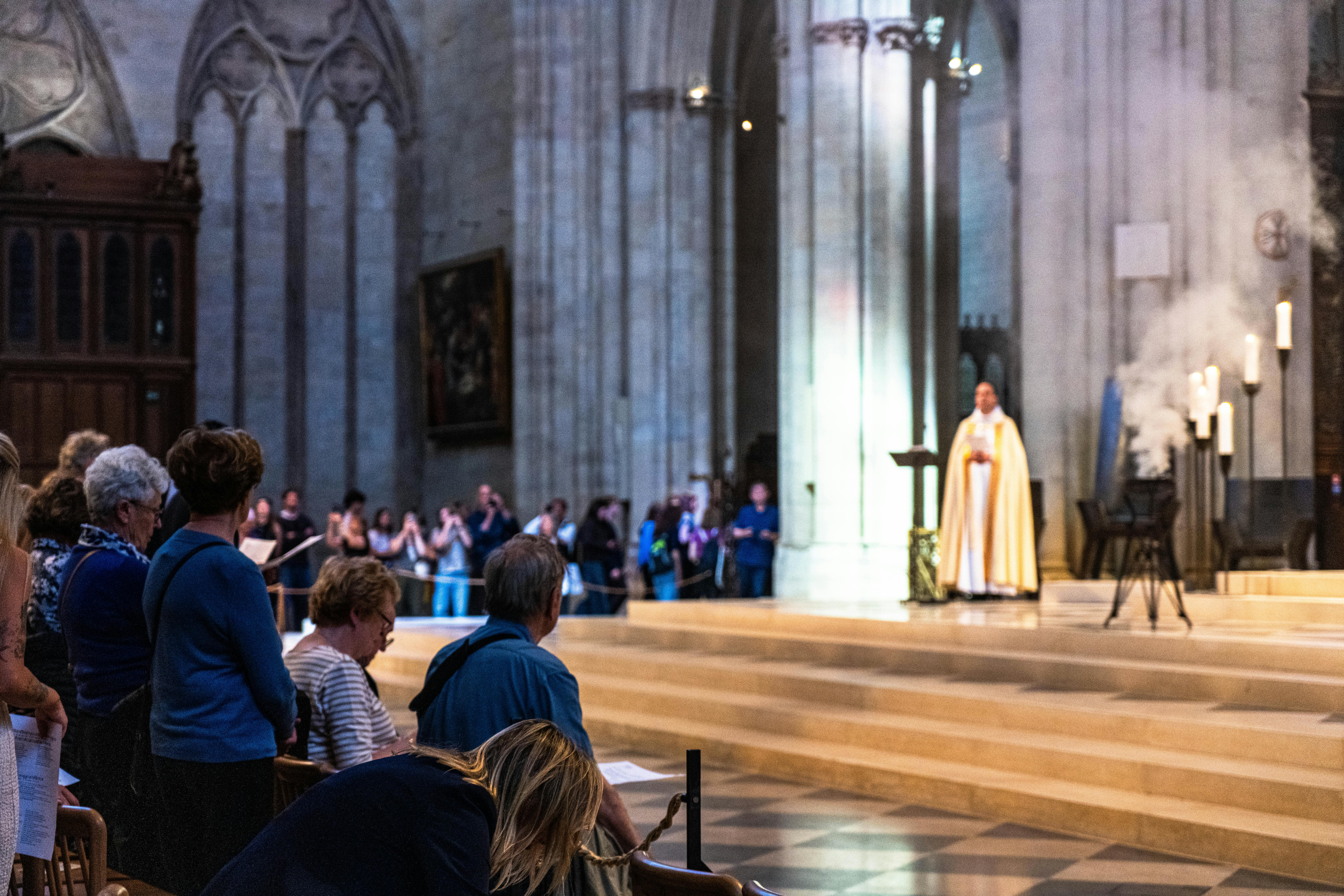 A priest in a church of Paris, France (taken by me)