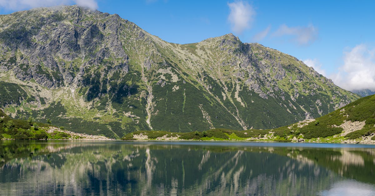 Serene mountain lake with stunning reflections in Zakopane, Poland.