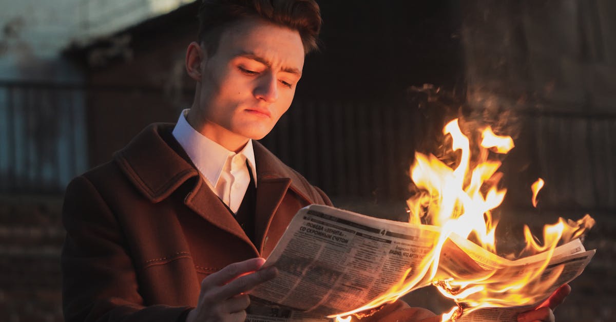 Man Reading Burning Newspaper Free Stock Photo Man Reading Burning Newspaper Free Stock Photo