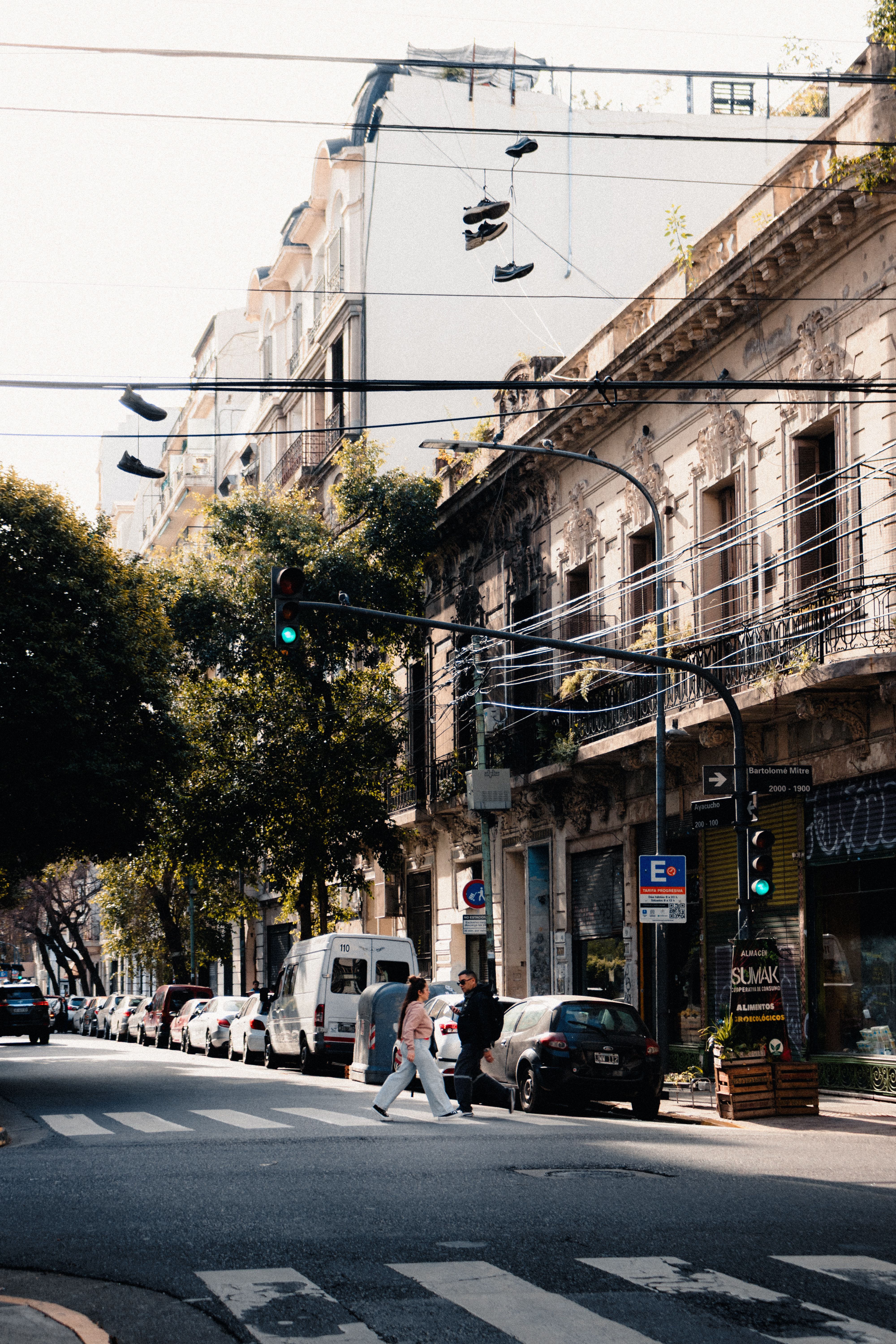A bustling Buenos Aires street scene with historic architecture and pedestrians.