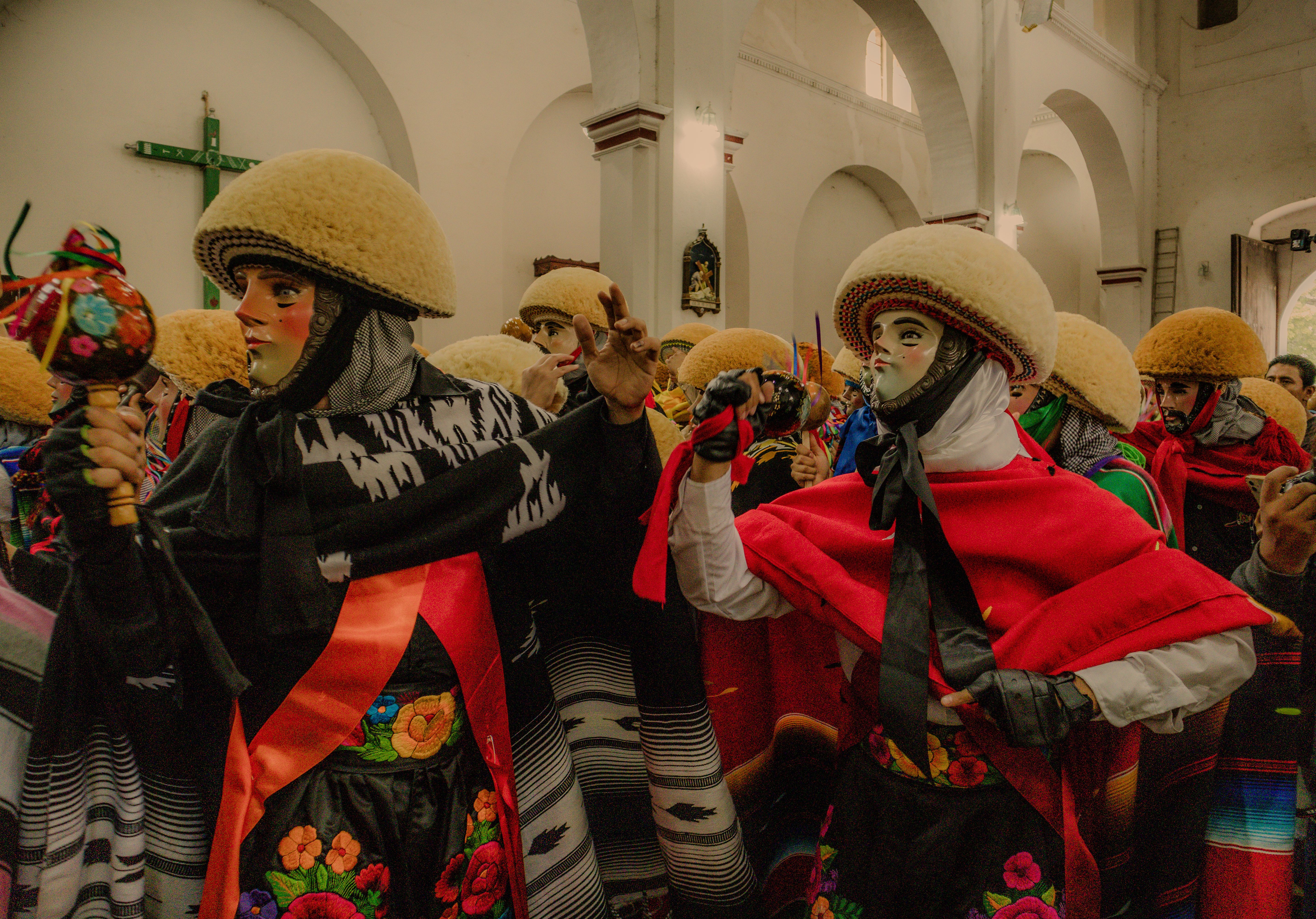 Vibrant Parachico dancers in ornate costumes celebrate in Chiapa de Corzo, Mexico.