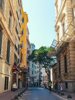A vibrant street scene in İstanbul showcasing historic architecture and daily life.