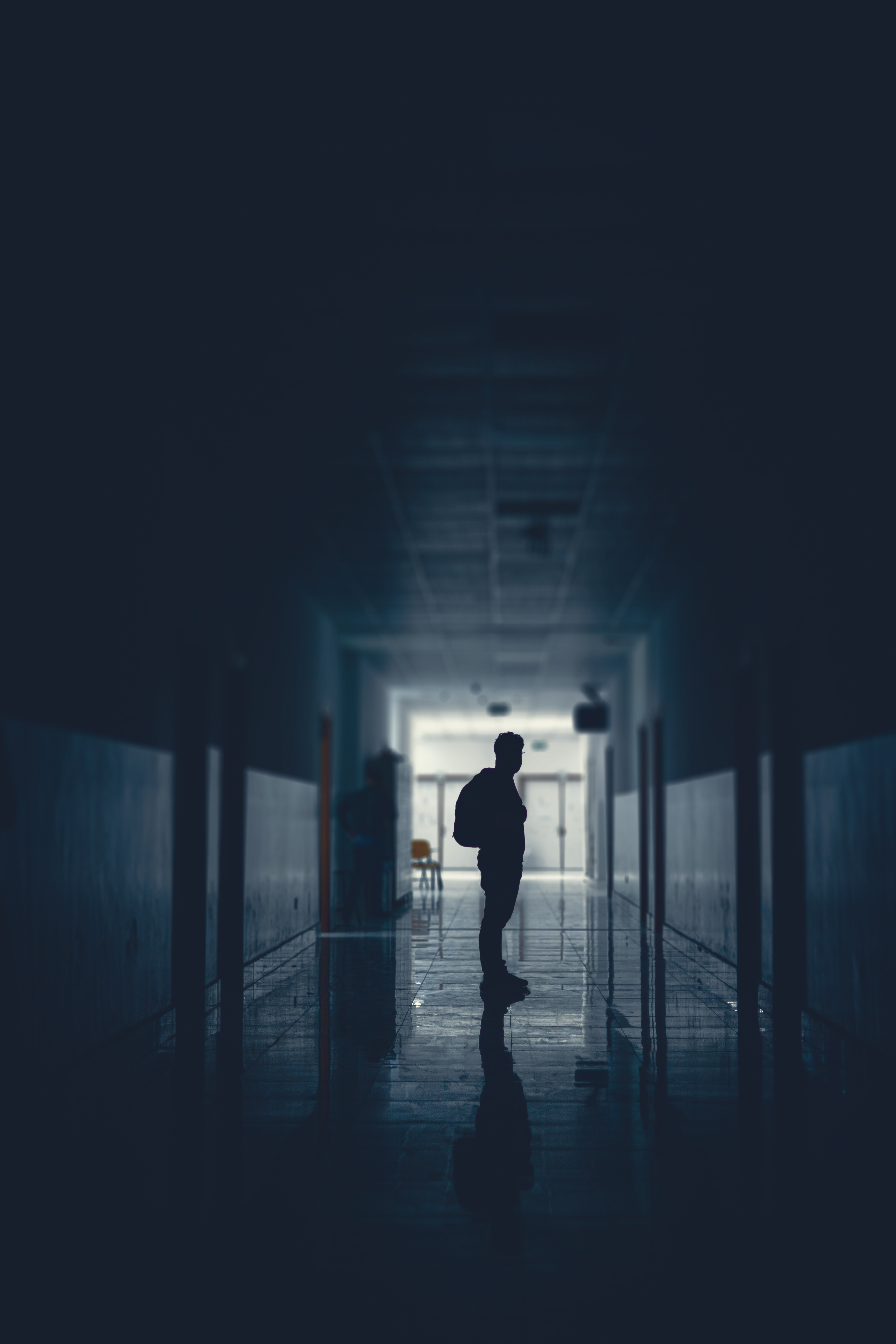 Silhouette of Person in Dark Hallway · Free Stock Photo