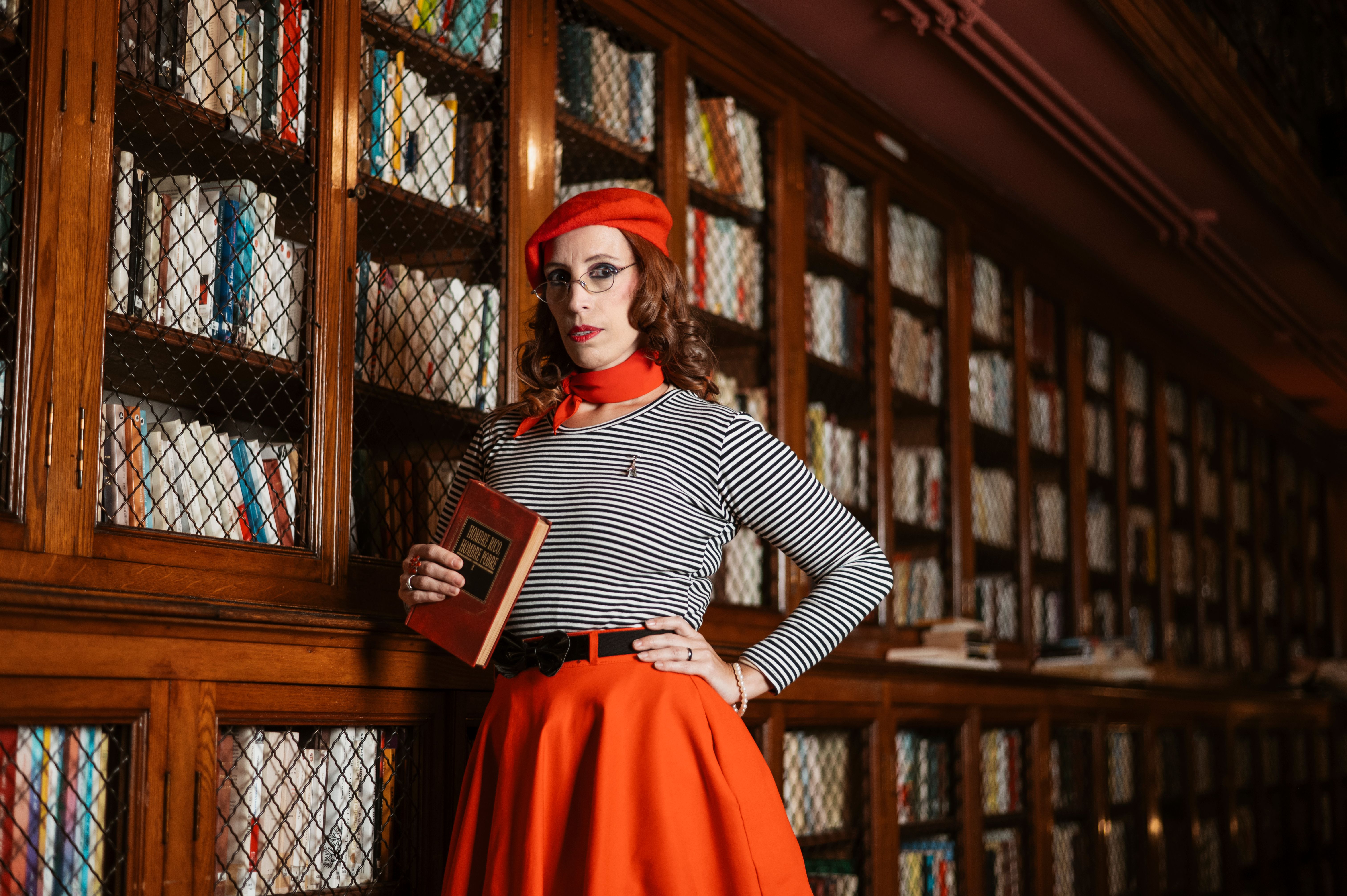 Stylish Woman in a Classic Library Setting · Free Stock Photo