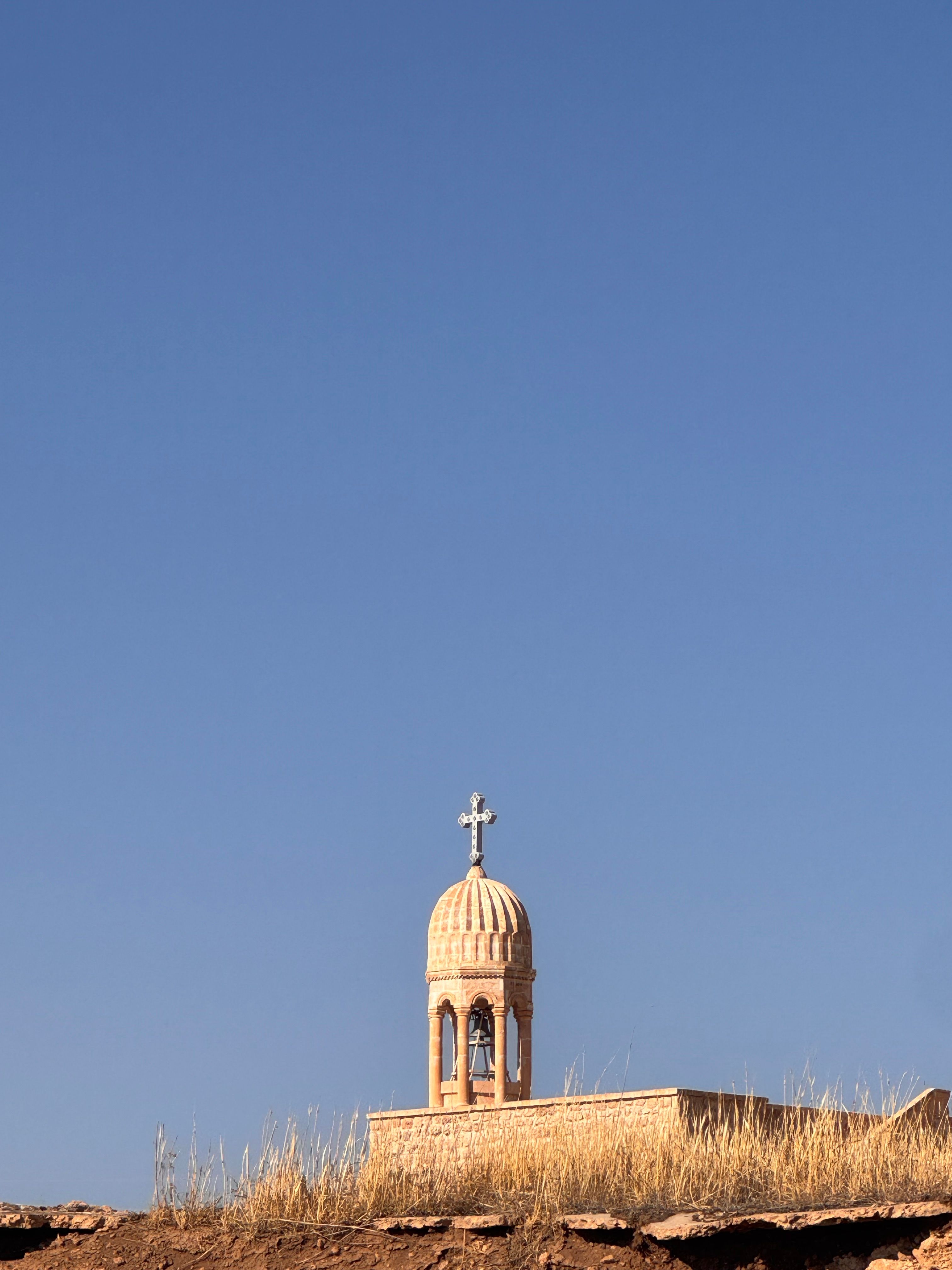 Historic Church Tower in Mardin Against Blue Sky · Free Stock Photo